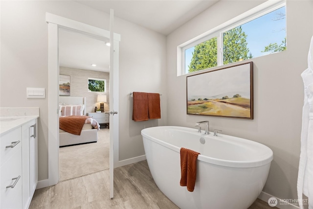 26808 NE 143rd Cir Unit 25, Duvall, WA 98019 - full bathroom featuring wood finished floors, a soaking tub, and vanity