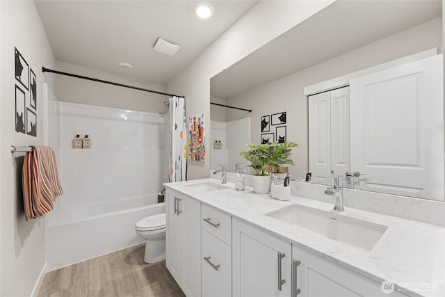 26808 NE 143rd Cir Unit 25, Duvall, WA 98019 - bathroom with double vanity, shower / bath combo with shower curtain, and wood finished floors