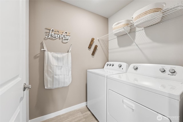 26808 NE 143rd Cir Unit 25, Duvall, WA 98019 - laundry area with washer and dryer and light wood-style flooring