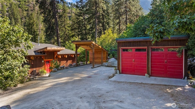 7189 Icicle Rd, Leavenworth, WA 98826 - detached garage featuring a view of trees