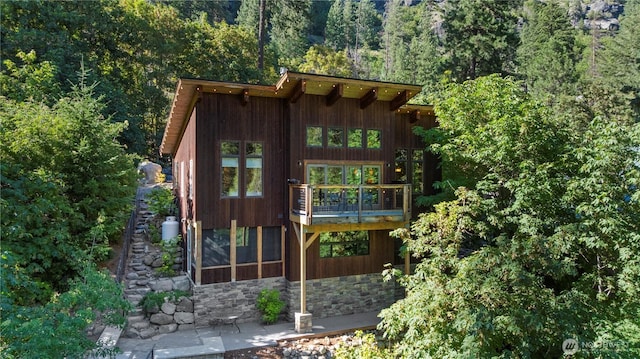 7189 Icicle Rd, Leavenworth, WA 98826 - back of property with a wooded view and stone siding