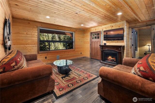 7189 Icicle Rd, Leavenworth, WA 98826 - living room featuring wood ceiling, wooden walls, a lit fireplace, recessed lighting, and hardwood / wood-style floors