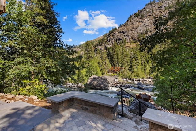 7189 Icicle Rd, Leavenworth, WA 98826 - view of patio with a mountain view and a view of trees