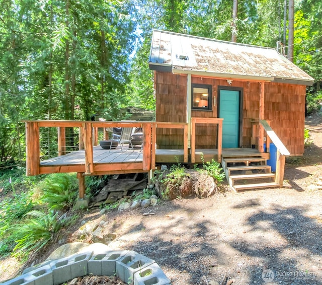 32113 Whitman Lake Dr, Graham, WA 98338 - view of front of home with a wooden deck and an outdoor structure