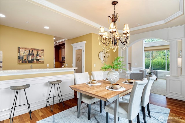 15025 SE 43rd St, Bellevue, WA 98006 - dining area with wood finished floors, arched walkways, recessed lighting, a raised ceiling, and a chandelier