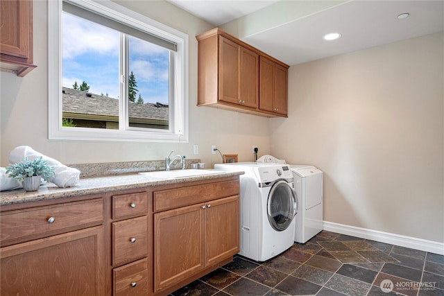15025 SE 43rd St, Bellevue, WA 98006 - washroom with washing machine and clothes dryer, cabinet space, dark stone finish floors, and recessed lighting