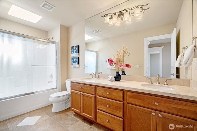 15025 SE 43rd St, Bellevue, WA 98006 - full bath with double vanity, combined bath / shower with glass door, and a skylight