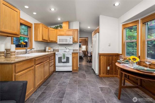 1546 Reservation Rd SE Unit 62, Olympia, WA 98513 - kitchen with white appliances, lofted ceiling, a wainscoted wall, light countertops, and recessed lighting