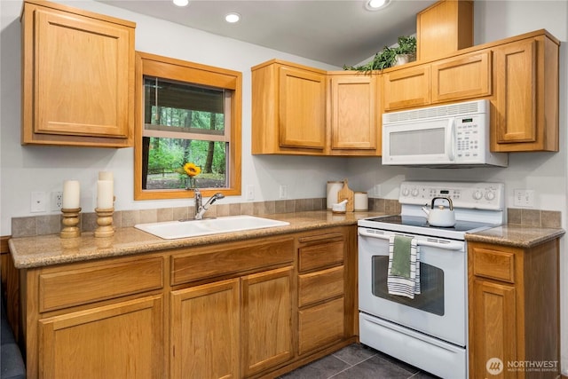 1546 Reservation Rd SE Unit 62, Olympia, WA 98513 - kitchen featuring white appliances, vaulted ceiling, recessed lighting, dark tile patterned flooring, and light countertops