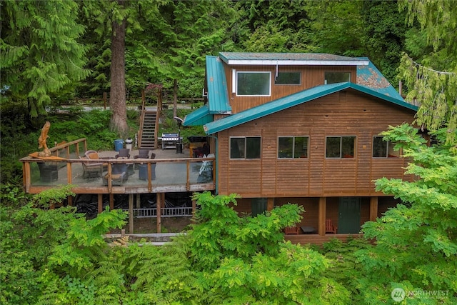 1546 Reservation Rd SE Unit 62, Olympia, WA 98513 - rear view of property with stairway and a wooden deck