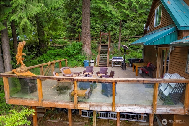 1546 Reservation Rd SE Unit 62, Olympia, WA 98513 - wooden terrace featuring stairs, a grill, and a fire pit