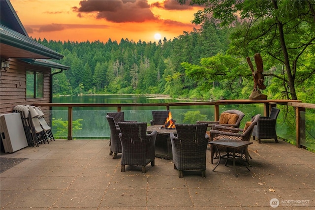 1546 Reservation Rd SE Unit 62, Olympia, WA 98513 - view of patio / terrace featuring a view of trees, a fire pit, and a water view