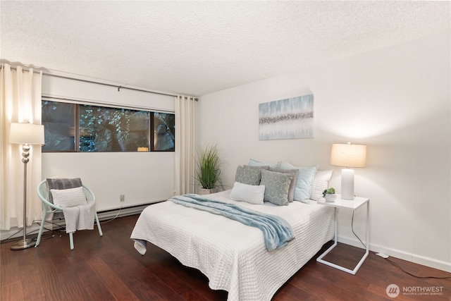 22315 6th Ave S Unit A109, Des Moines, WA 98198 - bedroom featuring wood finished floors and a textured ceiling