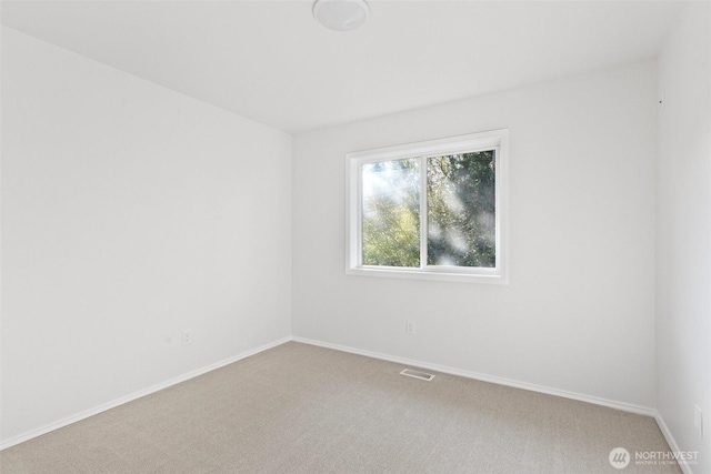 11511 188th St SE, Snohomish, WA 98296 - empty room with light colored carpet and baseboards
