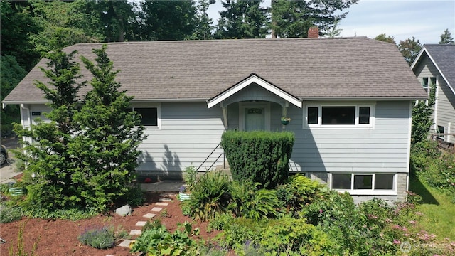 1209 Yew St, Bellingham, WA 98229 - view of front of property featuring a chimney, a shingled roof, and a garage