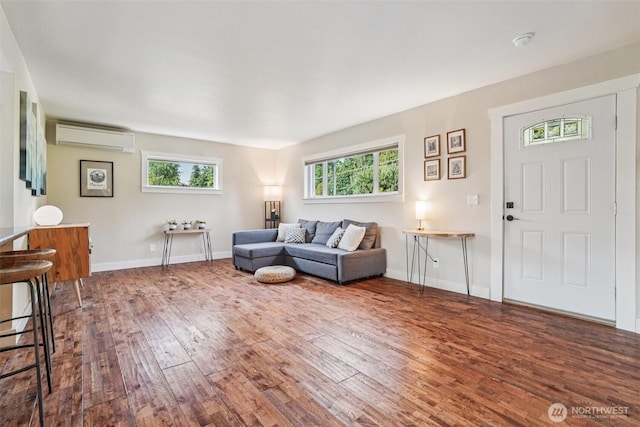 1209 Yew St, Bellingham, WA 98229 - living room featuring an AC wall unit and hardwood / wood-style flooring