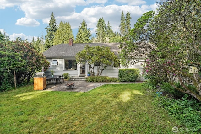 1209 Yew St, Bellingham, WA 98229 - rear view of house with a patio, a yard, and a chimney
