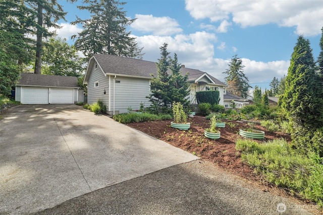1209 Yew St, Bellingham, WA 98229 - view of front of home featuring an outdoor structure, a garage, and a shingled roof