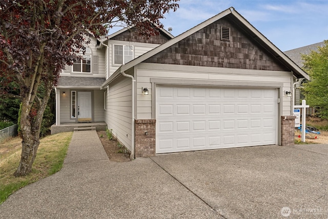 36261 23rd Pl S, Federal Way, WA 98003 - view of front of home featuring driveway, an attached garage, and brick siding