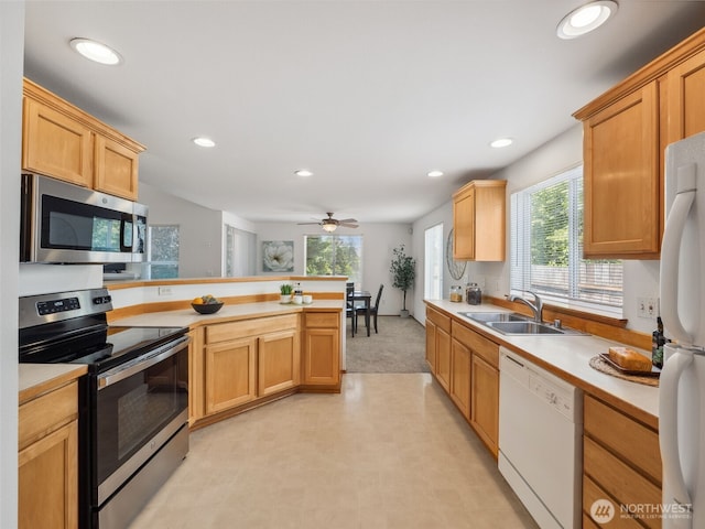 36261 23rd Pl S, Federal Way, WA 98003 - kitchen with appliances with stainless steel finishes, a peninsula, light countertops, and recessed lighting