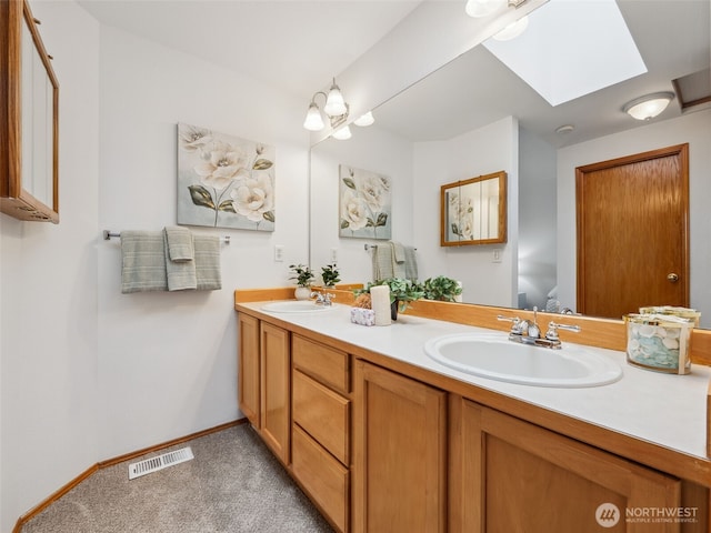 36261 23rd Pl S, Federal Way, WA 98003 - bathroom featuring a skylight and double vanity