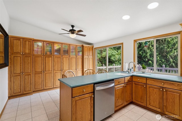 17837 Ashworth Ave N, Shoreline, WA 98133 - kitchen with dishwasher, lofted ceiling, a ceiling fan, brown cabinets, and light tile patterned floors
