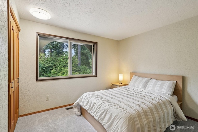 17837 Ashworth Ave N, Shoreline, WA 98133 - bedroom with carpet flooring, a textured ceiling, and a textured wall