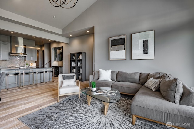 9424 Turnstone Ln Unit 29, Blaine, WA 98230 - living area with light wood-type flooring, high vaulted ceiling, recessed lighting, and a chandelier