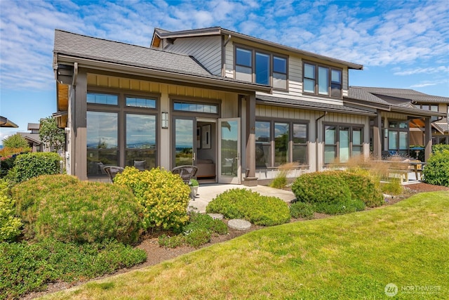 9424 Turnstone Ln Unit 29, Blaine, WA 98230 - back of house featuring a shingled roof and a yard