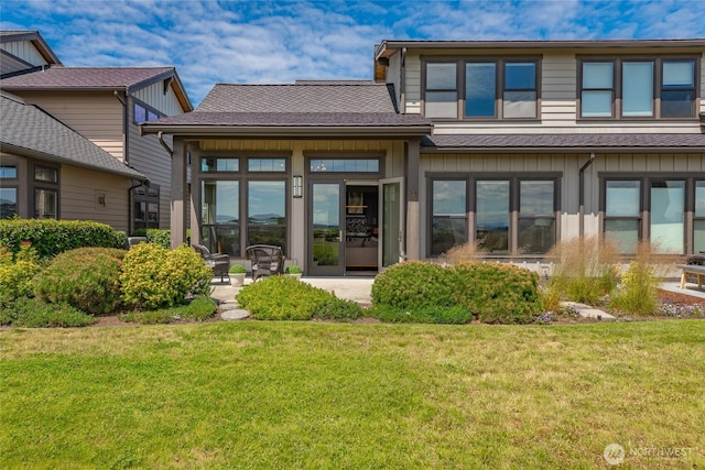 9424 Turnstone Ln Unit 29, Blaine, WA 98230 - rear view of house featuring a lawn and roof with shingles