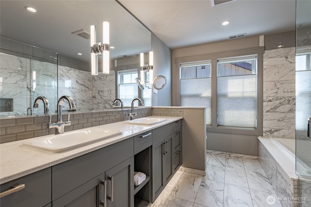 9424 Turnstone Ln Unit 29, Blaine, WA 98230 - full bath featuring double vanity, tasteful backsplash, recessed lighting, a bath, and marble finish floors