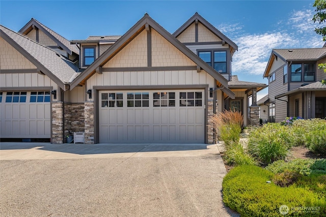 9424 Turnstone Ln Unit 29, Blaine, WA 98230 - craftsman-style house with stone siding, board and batten siding, an attached garage, and driveway
