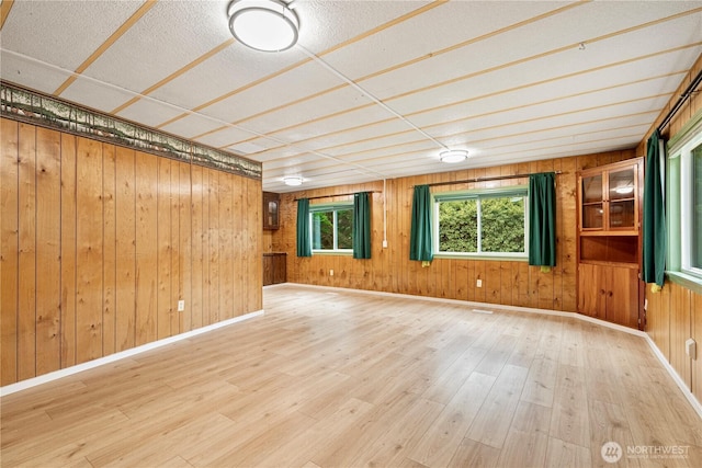 13632 SE 197th Pl, Renton, WA 98058 - empty room featuring wood finished floors and wood walls