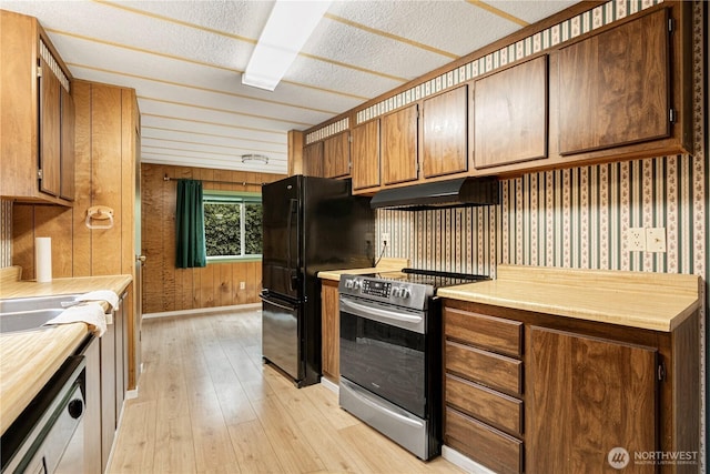 13632 SE 197th Pl, Renton, WA 98058 - kitchen with stainless steel electric stove, under cabinet range hood, white dishwasher, light wood finished floors, and wood walls