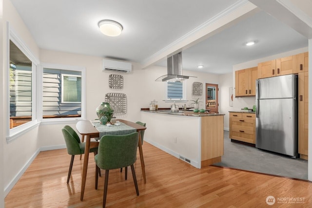 8051 30th Ave NW, Seattle, WA 98117 - dining space with light wood-type flooring, a wall mounted AC, and recessed lighting