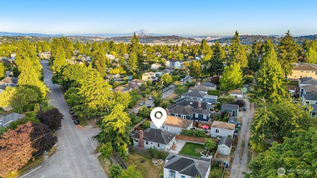 8051 30th Ave NW, Seattle, WA 98117 - aerial perspective of suburban area featuring a mountain backdrop