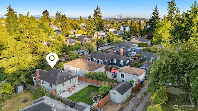 8051 30th Ave NW, Seattle, WA 98117 - aerial view of residential area featuring a mountainous background