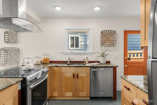8051 30th Ave NW, Seattle, WA 98117 - kitchen featuring stainless steel appliances, exhaust hood, dark stone counters, and tile patterned floors
