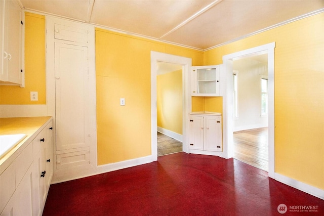 835 J St, Port Townsend, WA 98368 - kitchen with light countertops, white cabinetry, and concrete floors