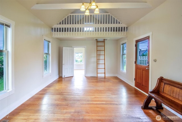 835 J St, Port Townsend, WA 98368 - entryway featuring light wood-type flooring, plenty of natural light, high vaulted ceiling, and a chandelier