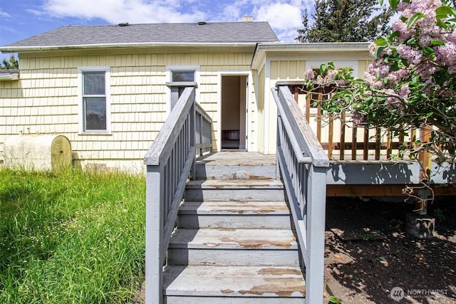 835 J St, Port Townsend, WA 98368 - property entrance with oil tank and roof with shingles