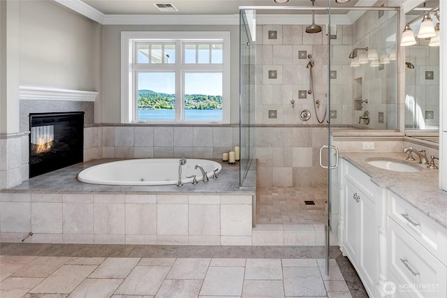 8066 Avalon Pl, Mercer Island, WA 98040 - full bath featuring ornamental molding, a jetted tub, vanity, a shower stall, and a glass covered fireplace