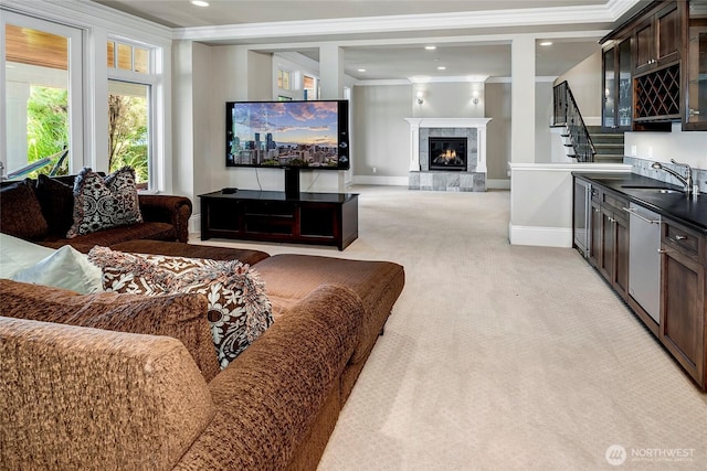 8066 Avalon Pl, Mercer Island, WA 98040 - living room featuring ornamental molding, light colored carpet, a high end fireplace, recessed lighting, and stairs