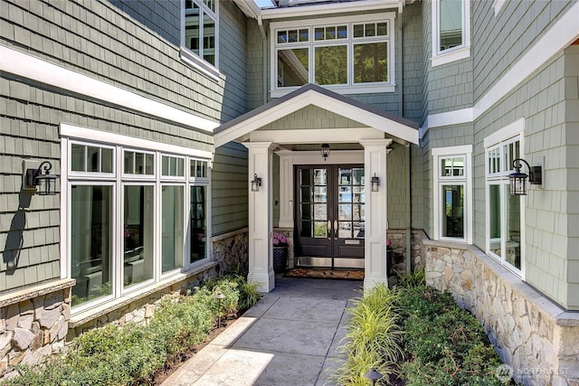 8066 Avalon Pl, Mercer Island, WA 98040 - view of exterior entry with french doors and stone siding