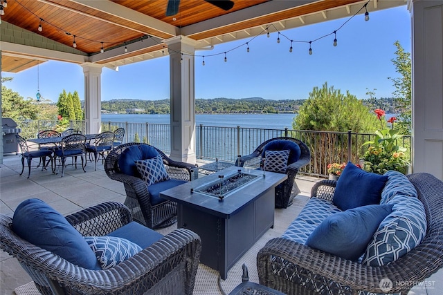 8066 Avalon Pl, Mercer Island, WA 98040 - view of patio with an outdoor living space with a fire pit, ceiling fan, a water view, and outdoor dining area