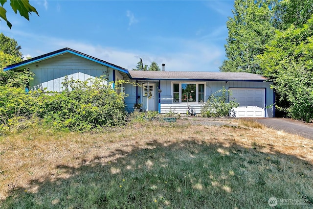 15414 121st Avenue Ct E, Puyallup, WA 98374 - ranch-style home with an attached garage, driveway, and a front lawn