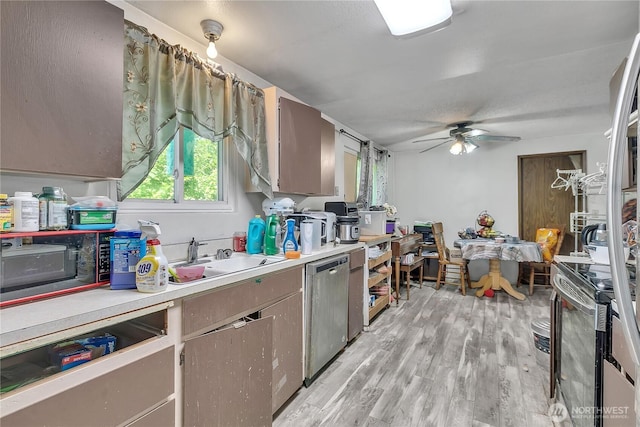 15414 121st Avenue Ct E, Puyallup, WA 98374 - kitchen featuring stainless steel appliances, a ceiling fan, light countertops, and light wood finished floors