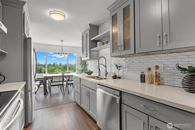4545 Sand Point Way NE Unit 806, Seattle, WA 98105 - kitchen with stainless steel appliances, gray cabinetry, and dark wood-type flooring