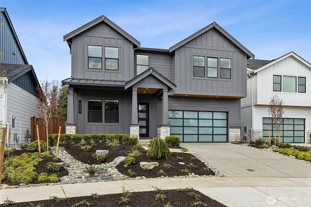 14449 133rd Pl NE, Woodinville, WA 98072 - view of front of property with board and batten siding, a garage, stone siding, and concrete driveway