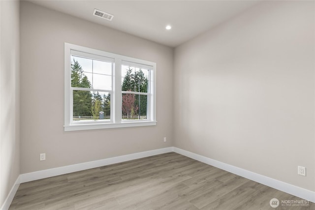 14449 133rd Pl NE, Woodinville, WA 98072 - spare room featuring light wood-type flooring and recessed lighting
